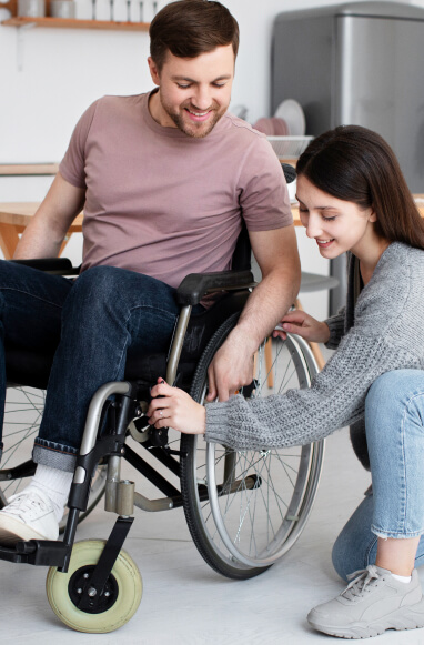 Person in wheelchair with caregiver